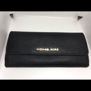 Black with gold lettering Michael Kors wallet